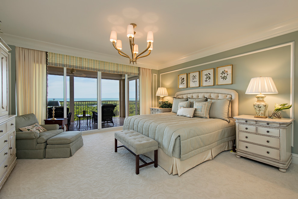 Example of a classic master carpeted bedroom design in Miami with green walls