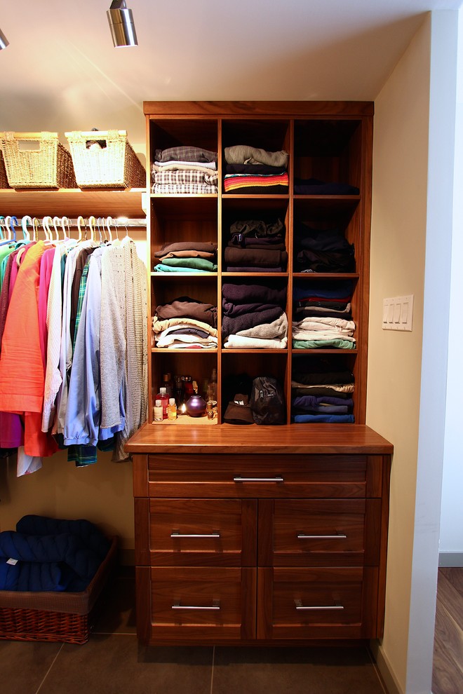 Inspiration for a mid-sized transitional gender-neutral porcelain tile walk-in closet remodel with shaker cabinets and medium tone wood cabinets