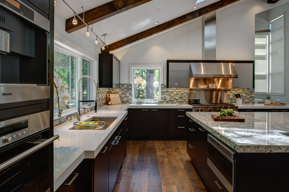 Design ideas for an expansive contemporary l-shaped eat-in kitchen in San Francisco with an undermount sink, flat-panel cabinets, dark wood cabinets, quartz benchtops, blue splashback, mosaic tile splashback, stainless steel appliances, dark hardwood floors and with island.