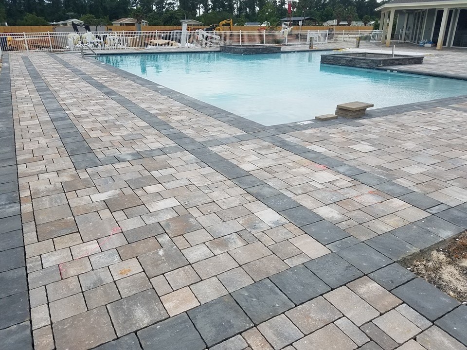 Hot tub - large transitional backyard stone and custom-shaped natural hot tub idea in Miami