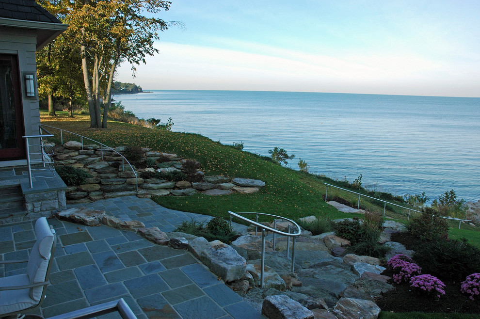 Inspiration for a mid-sized arts and crafts backyard patio in Cleveland with a vertical garden, natural stone pavers and no cover.