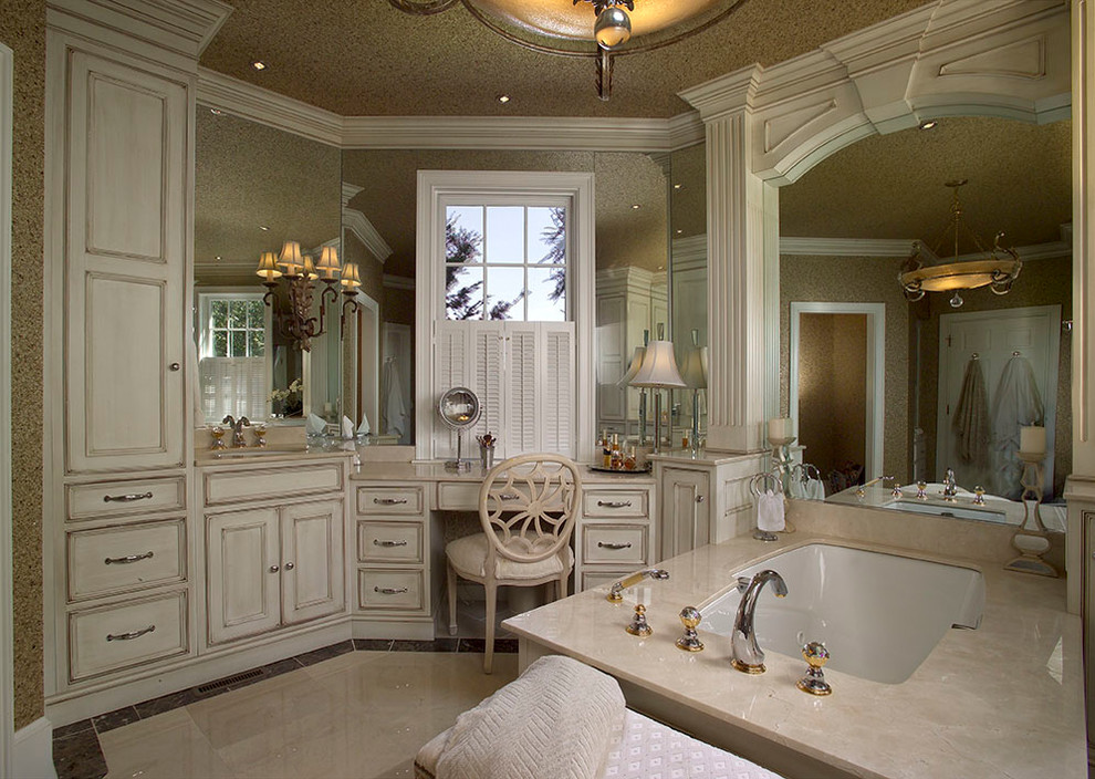 Large traditional master bathroom in Other with beaded inset cabinets, beige cabinets, a freestanding tub, white tile, stone tile, beige walls, marble floors, an undermount sink and marble benchtops.