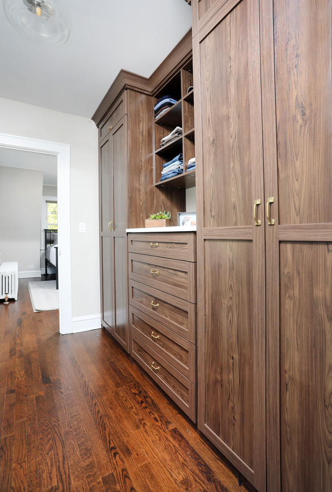 This is an example of a transitional storage and wardrobe in Chicago.