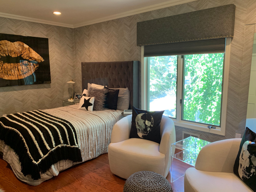 This is an example of a mid-sized modern bedroom in New York with grey walls, medium hardwood floors, brown floor and wallpaper.