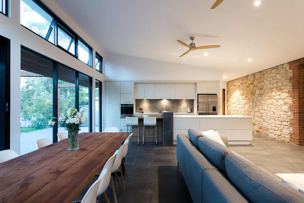 Large contemporary kitchen/dining combo in Adelaide with ceramic floors and no fireplace.