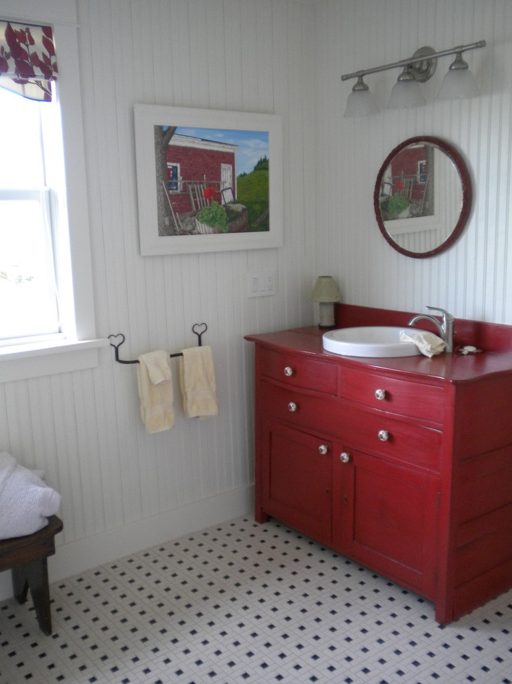 Inspiration for a mid-sized country 3/4 bathroom in Other with recessed-panel cabinets, red cabinets, a one-piece toilet, white walls, porcelain floors, a drop-in sink, wood benchtops and red benchtops.