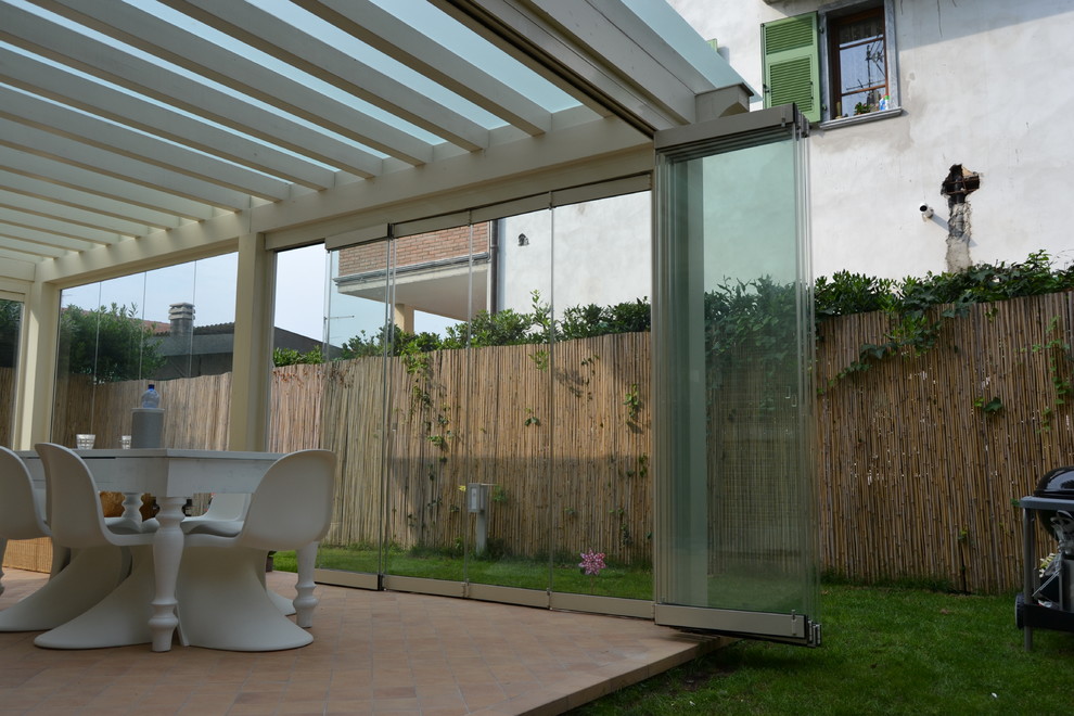 Photo of a contemporary sunroom in Milan.