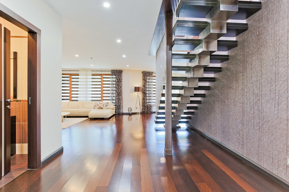 Mid-sized contemporary wood straight staircase in Toronto with wood risers.