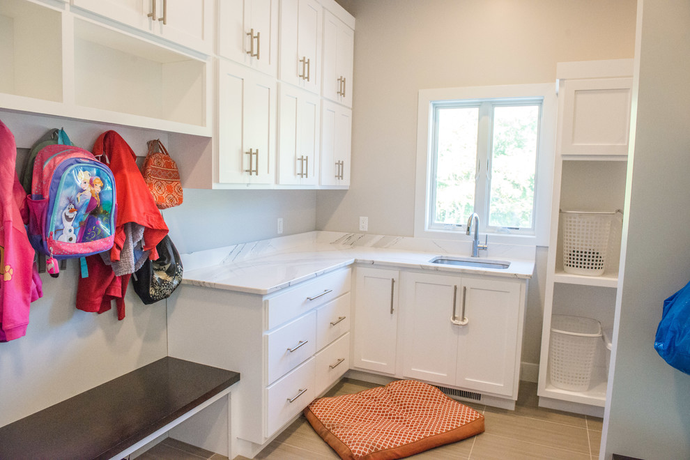 Inspiration for a huge ceramic tile and multicolored floor mudroom remodel