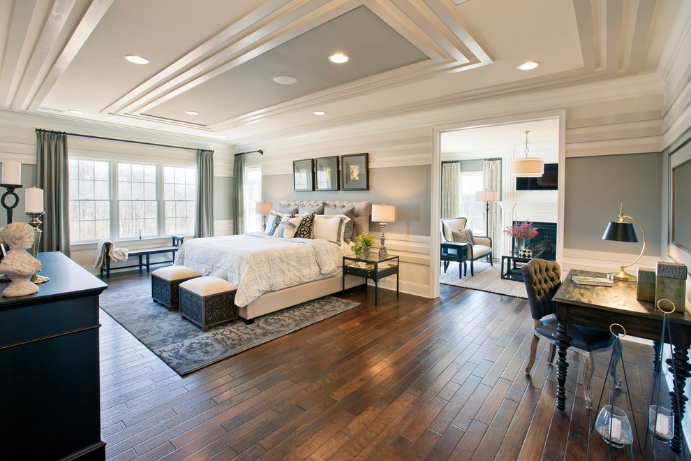 Large traditional bedroom in Philadelphia with grey walls and dark hardwood floors.