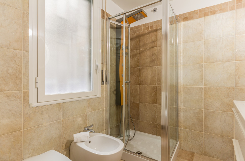 Photo of a small modern 3/4 bathroom in Rome with furniture-like cabinets, white cabinets, a corner shower, brown tile, porcelain tile, white walls, porcelain floors, a drop-in sink, brown floor, a sliding shower screen, a single vanity and a floating vanity.