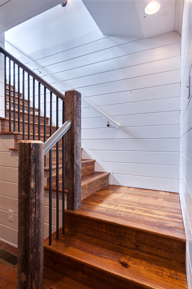 Inspiration for a mid-sized country wood l-shaped staircase in Atlanta with wood risers.