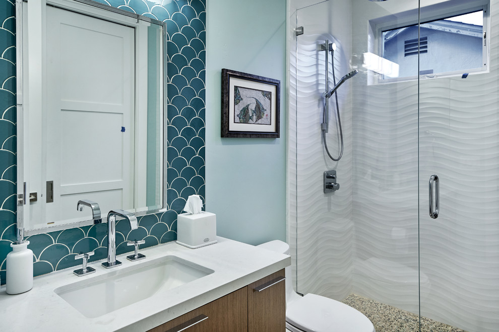 Inspiration for a transitional 3/4 bathroom in San Francisco with flat-panel cabinets, medium wood cabinets, an alcove shower, white tile, blue walls, an undermount sink and white benchtops.