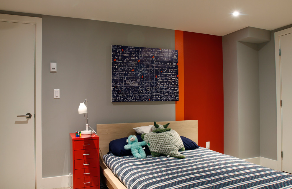 Mid-sized contemporary gender-neutral kids' bedroom in Denver with grey walls for kids 4-10 years old.