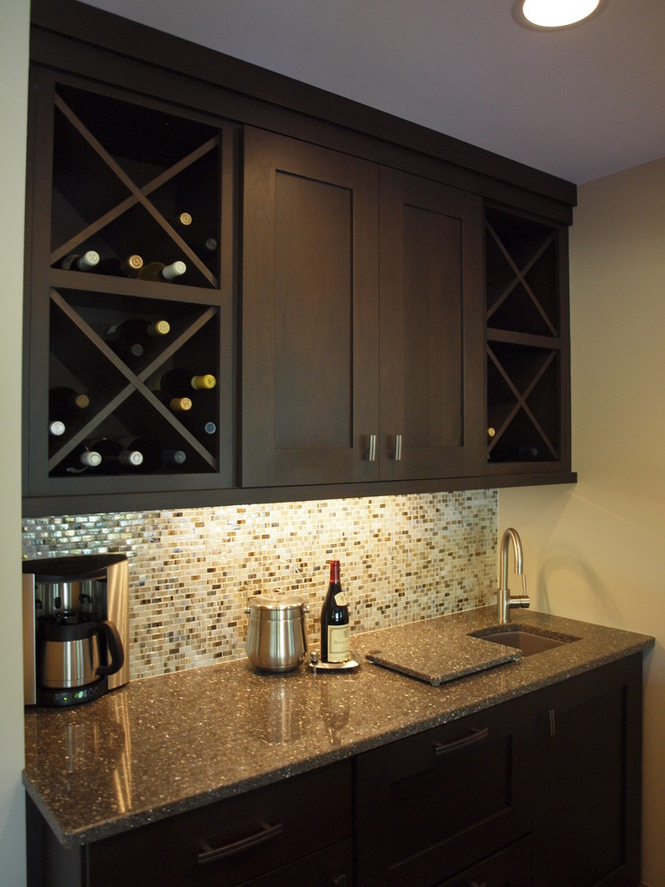 Inspiration for a mid-sized contemporary single-wall seated home bar in Chicago with an undermount sink, shaker cabinets, dark wood cabinets, brown splashback and mosaic tile splashback.