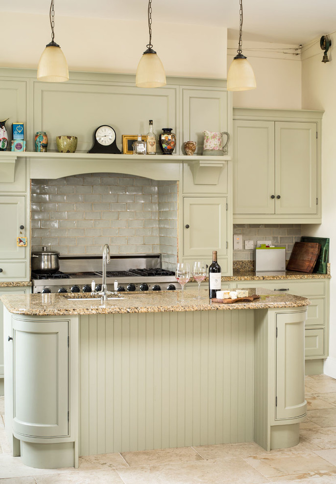 Photo of a traditional kitchen in Dublin with beaded inset cabinets, green cabinets and with island.