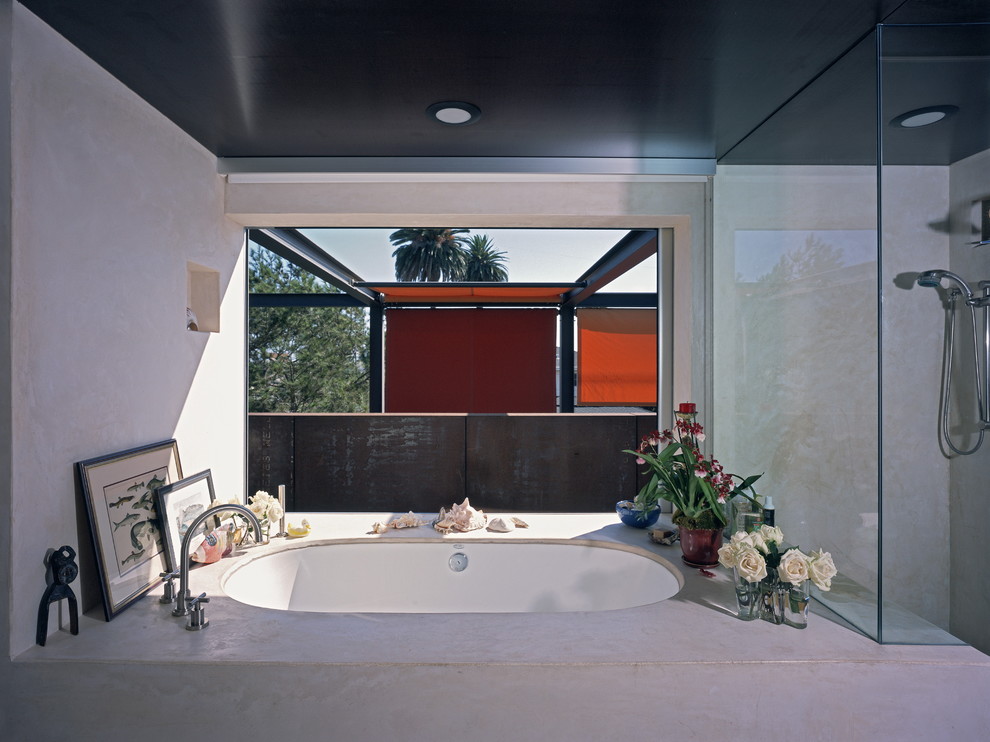Photo of an industrial bathroom in Los Angeles with an undermount tub.