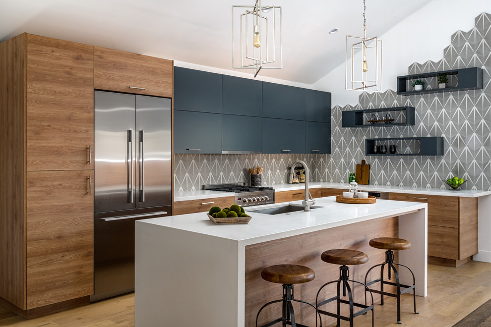 Design ideas for a large contemporary l-shaped open plan kitchen in Orange County with with island, an undermount sink, flat-panel cabinets, medium wood cabinets, grey splashback, stainless steel appliances, medium hardwood floors and beige floor.
