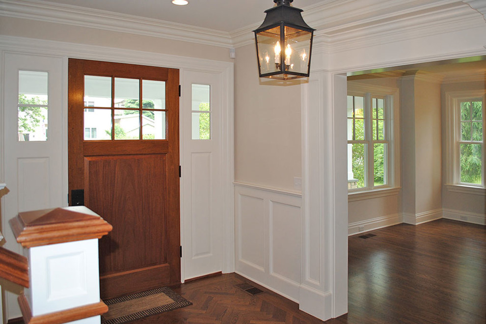 Front door - mid-sized transitional dark wood floor and brown floor front door idea with white walls and a medium wood front door