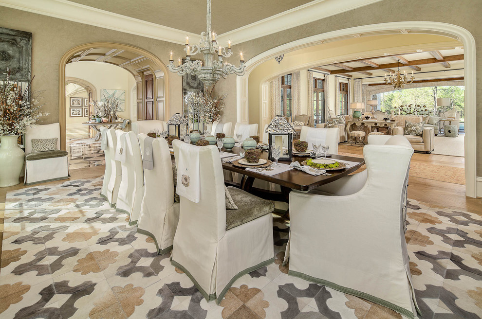 This is an example of a traditional dining room in Dallas with medium hardwood floors and beige walls.