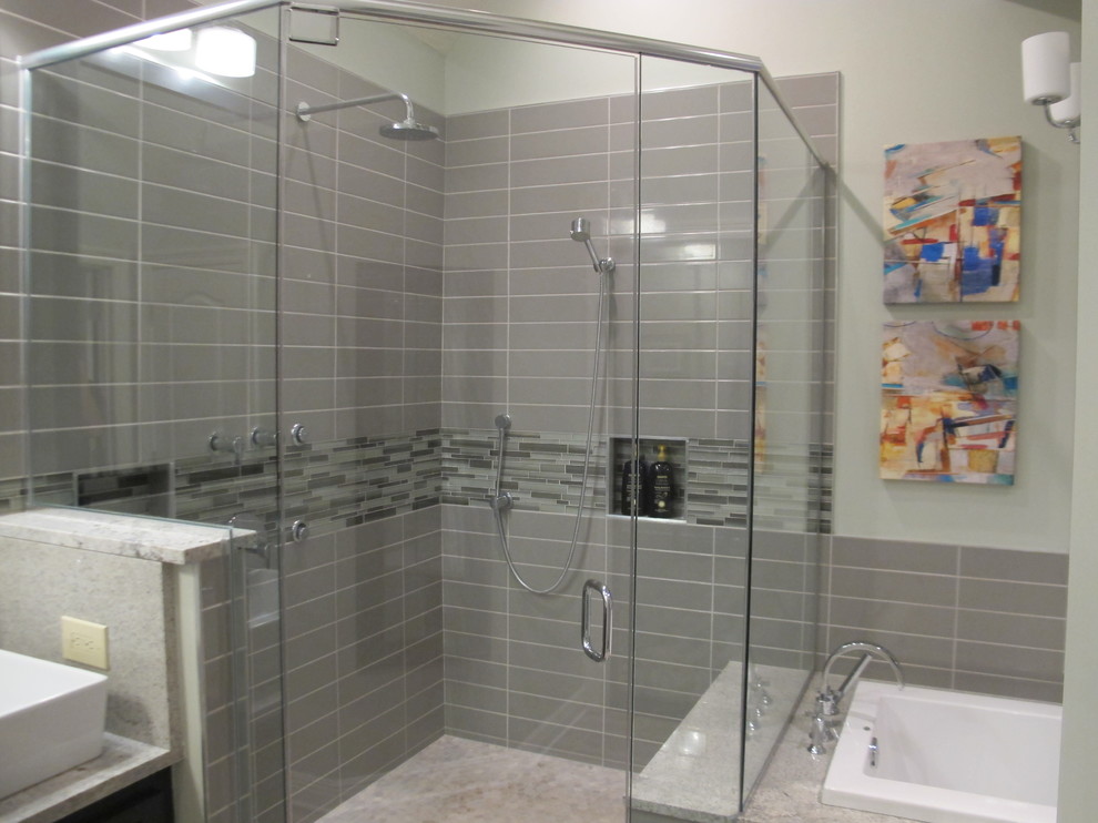 Mid-sized modern master bathroom in Other with shaker cabinets, black cabinets, a drop-in tub, a corner shower, a two-piece toilet, multi-coloured tile, stone slab, green walls, porcelain floors and a vessel sink.