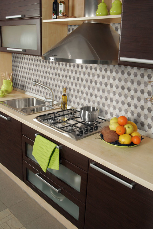 Mid-sized transitional ceramic tile kitchen photo in Orange County with a double-bowl sink, flat-panel cabinets, dark wood cabinets, granite countertops, multicolored backsplash, ceramic backsplash and stainless steel appliances
