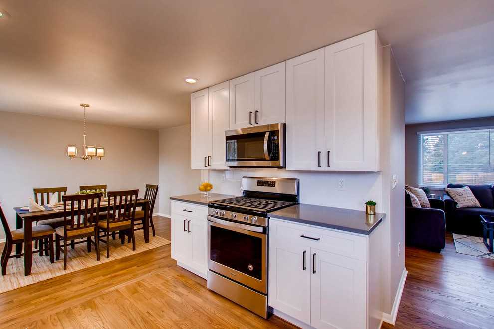 Example of a transitional kitchen design in Denver