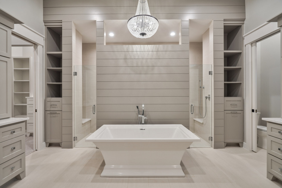 Inspiration for a large craftsman master porcelain tile, beige floor, double-sink and shiplap wall bathroom remodel in Houston with recessed-panel cabinets, gray cabinets, a one-piece toilet, gray walls, an undermount sink, a hinged shower door, white countertops and a built-in vanity