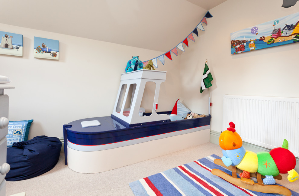 Photo of a beach style kids' room in Surrey.