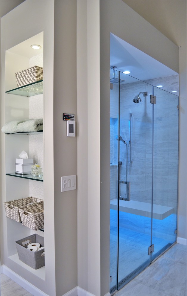 This is an example of a mid-sized modern master bathroom in Other with flat-panel cabinets, brown cabinets, a freestanding tub, a curbless shower, a one-piece toilet, gray tile, porcelain tile, grey walls, porcelain floors, a vessel sink, engineered quartz benchtops, white floor, a hinged shower door and white benchtops.