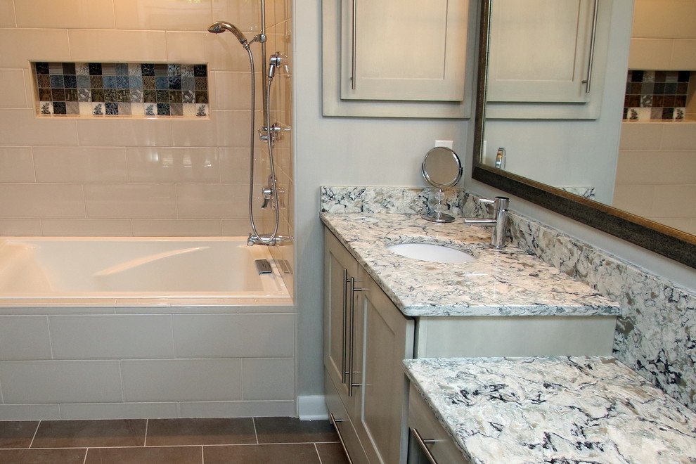 Bathroom - mid-sized transitional gray tile and porcelain tile porcelain tile bathroom idea with gray walls and a drop-in sink