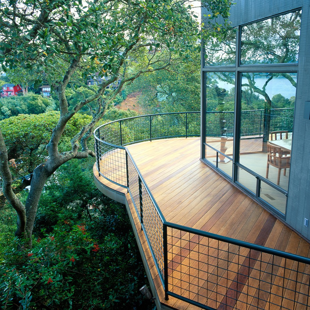 Inspiration for a mid-sized contemporary balcony in San Francisco with no cover, metal railing and with privacy feature.