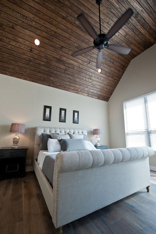 Traditional master bedroom in Austin with medium hardwood floors.