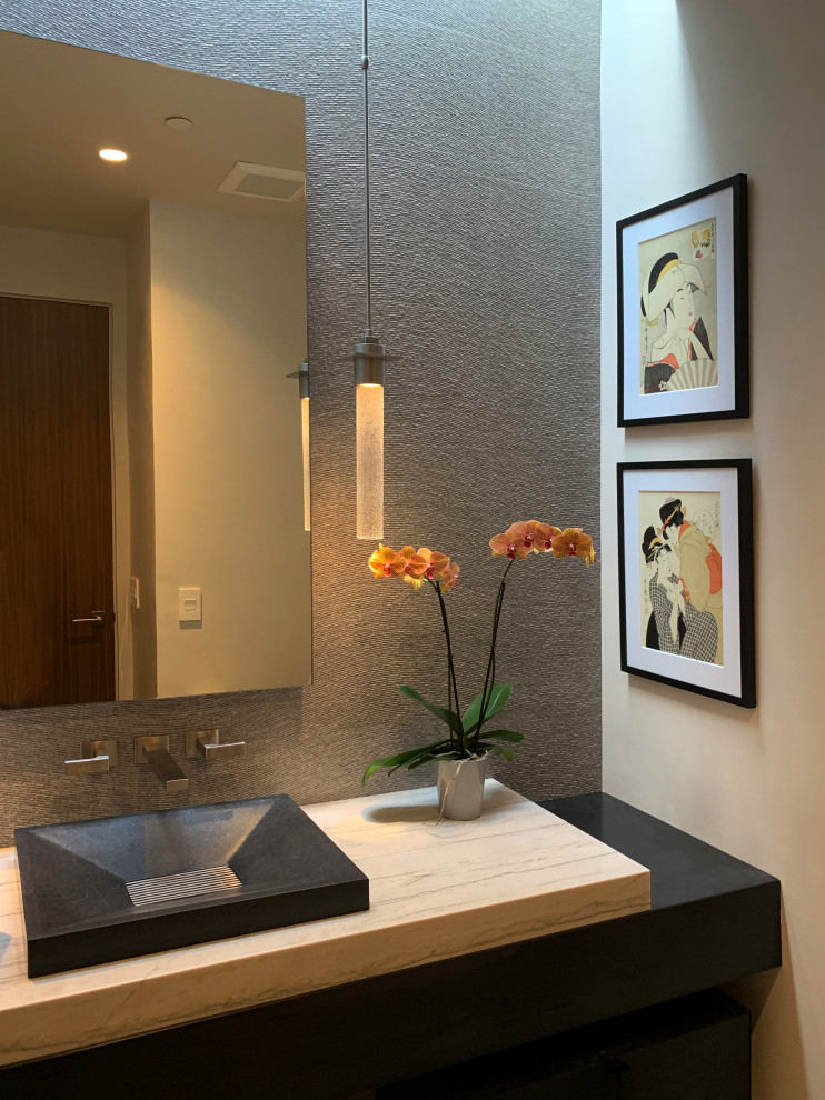 Photo of a large midcentury powder room in Albuquerque with flat-panel cabinets, black cabinets, beige tile, porcelain tile, white walls, porcelain floors, an undermount sink, grey floor, grey benchtops and granite benchtops.