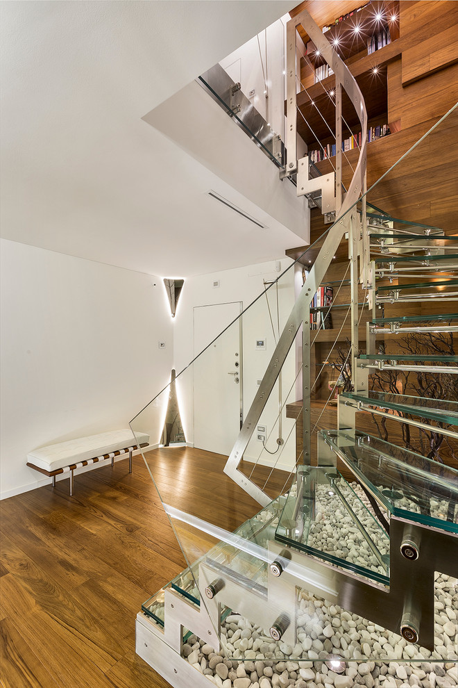 This is an example of a small contemporary glass u-shaped staircase in Bari with open risers.