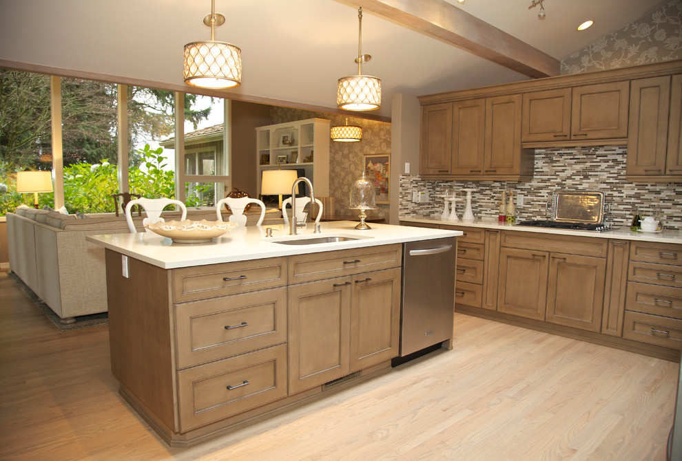 Photo of a traditional l-shaped open plan kitchen in Seattle with an undermount sink, recessed-panel cabinets, medium wood cabinets, quartz benchtops, multi-coloured splashback and stainless steel appliances.