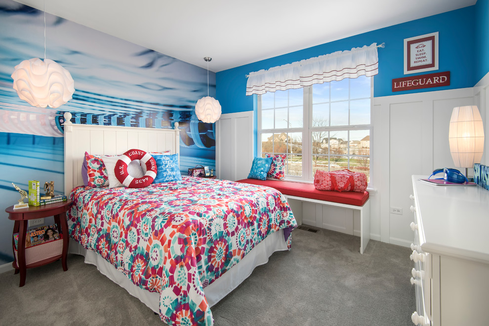 This is an example of a mid-sized eclectic kids' room for girls in Chicago with blue walls and carpet.