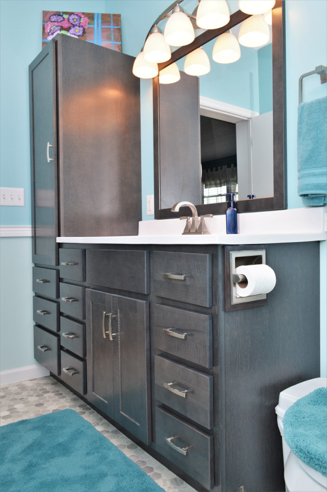 Photo of a mid-sized country master bathroom in Other with shaker cabinets, grey cabinets, blue walls, laminate floors, an integrated sink, marble benchtops, white benchtops, a single vanity and a freestanding vanity.