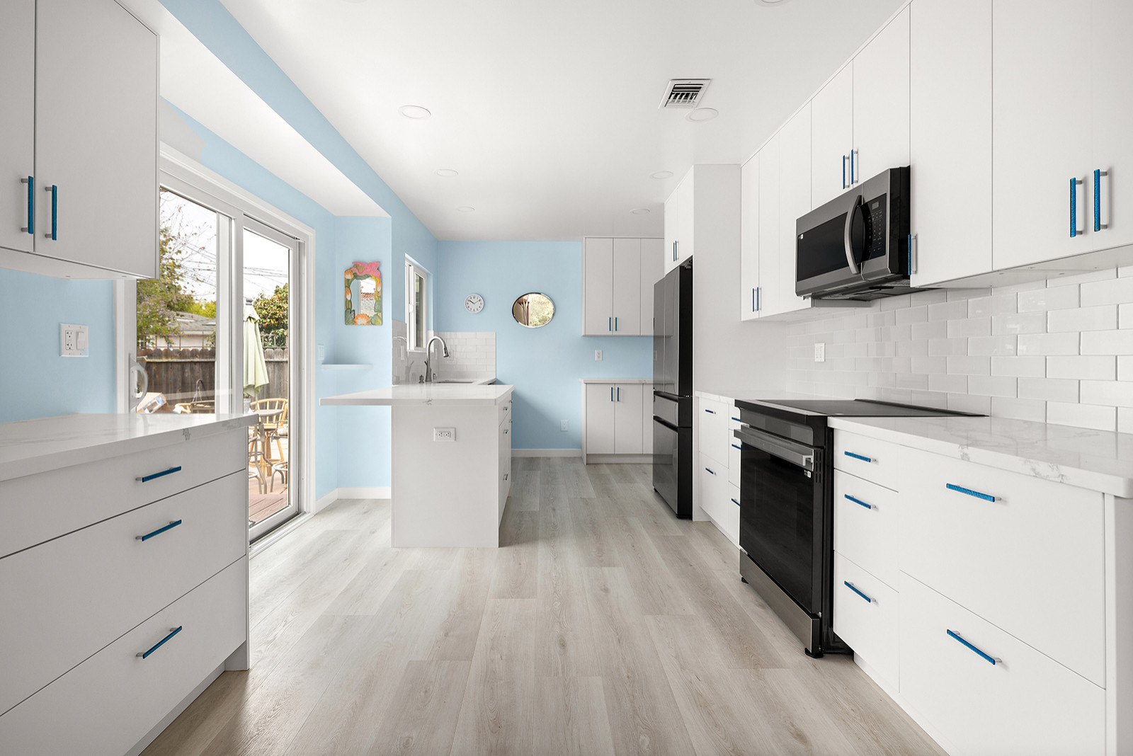 Plank Vinyl Laminate Flooring, Cabinetry, Countertops, Tile Backsplash and Appli