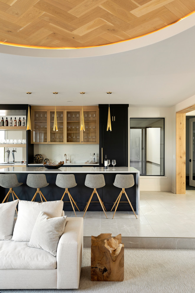 Inspiration for a transitional galley seated home bar in Minneapolis with an undermount sink, quartz benchtops, white splashback, engineered quartz splashback, beige floor and white benchtop.