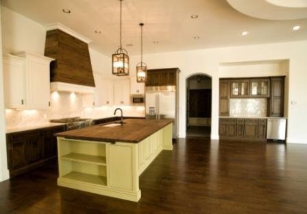 Inspiration for a large transitional l-shaped dark wood floor open concept kitchen remodel in Austin with an undermount sink, recessed-panel cabinets, white cabinets, marble countertops, gray backsplash, marble backsplash, stainless steel appliances and an island