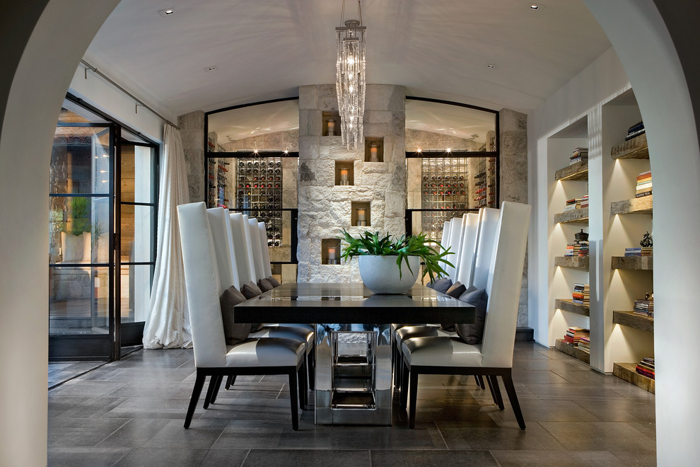 Example of a large tuscan dining room design in Orange County
