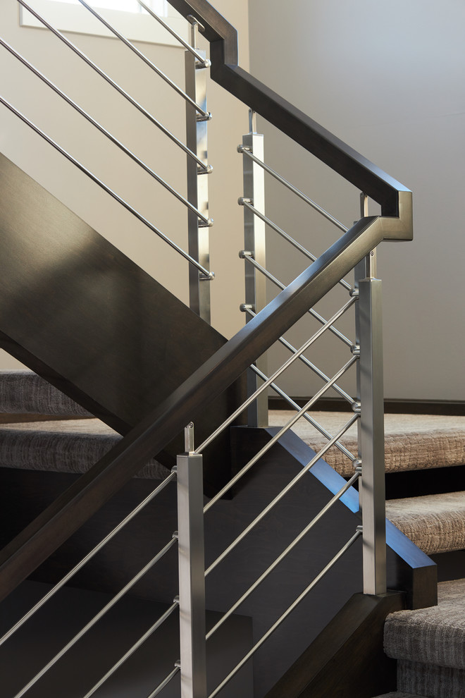 Design ideas for a large modern carpeted floating staircase in Edmonton with mixed railing.