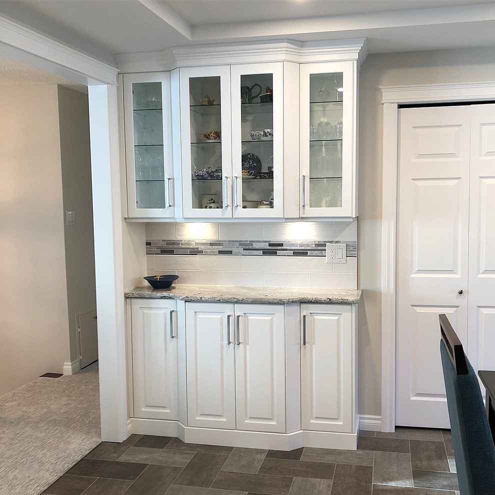Kitchen - transitional kitchen idea with white cabinets and quartz countertops