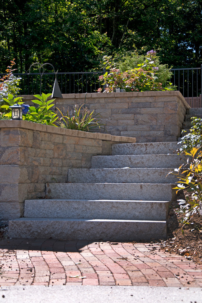 Design ideas for a rustic front yard concrete paver driveway in Boston.