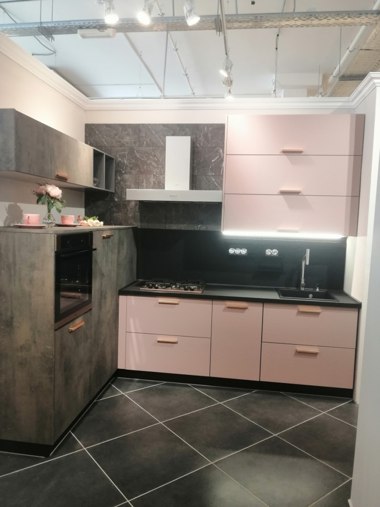 Inspiration for a mid-sized modern l-shaped eat-in kitchen in Other with an undermount sink, flat-panel cabinets, pink cabinets, wood benchtops, black splashback, black appliances and black benchtop.