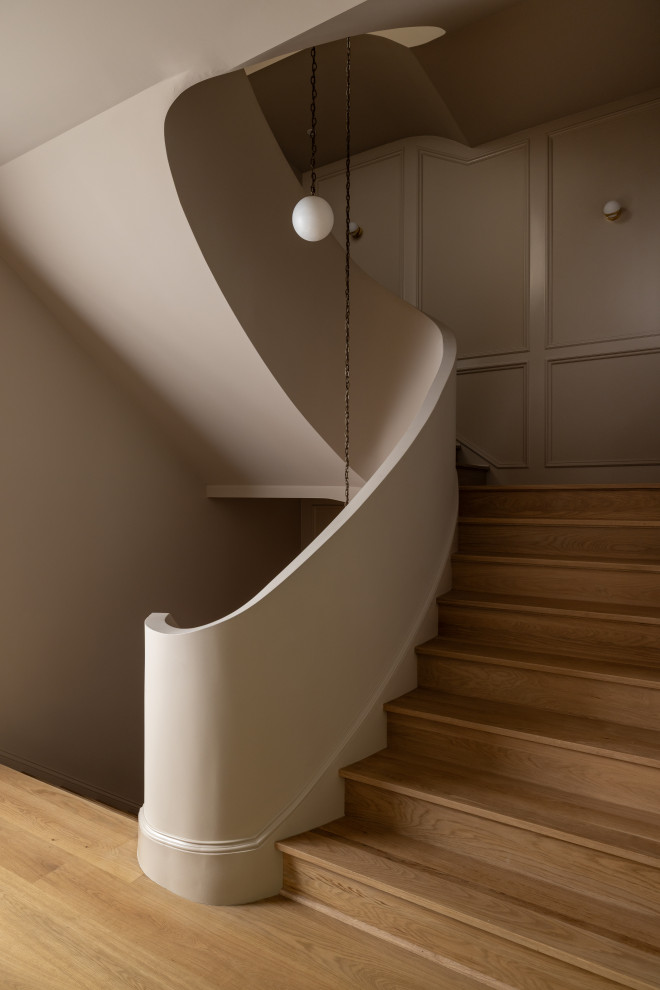 Transitional wooden u-shaped wall paneling staircase photo in DC Metro with wooden risers