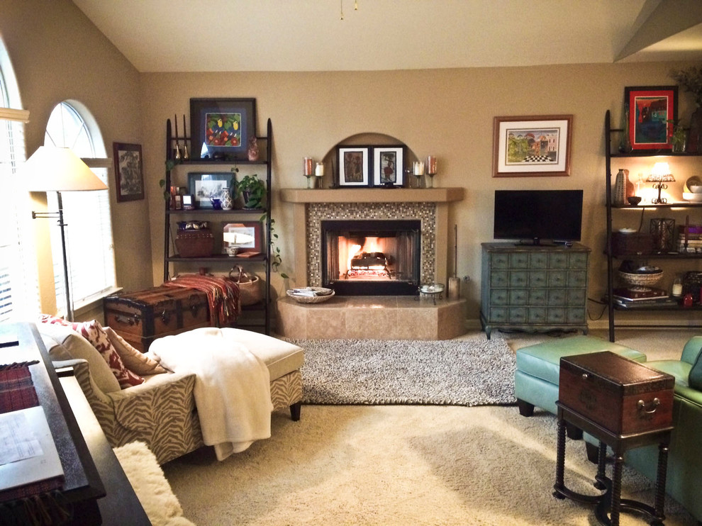 Mid-sized eclectic formal loft-style living room in Other with beige walls, carpet, a standard fireplace, a tile fireplace surround, a freestanding tv and beige floor.