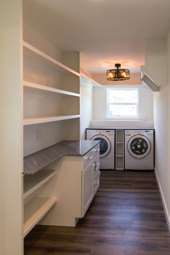 Design ideas for a large transitional laundry room in Dallas.