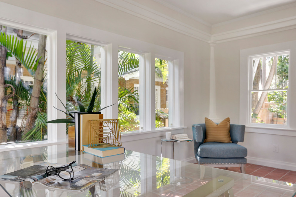 Photo of a mid-sized transitional sunroom in Tampa with terra-cotta floors and a standard ceiling.